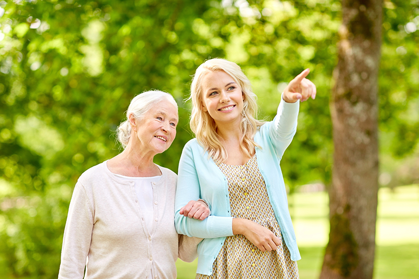 Daughter with senior mother at park