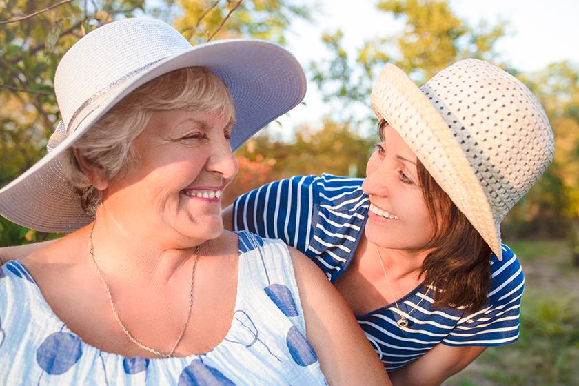 happy-daughter-embracing-her-smiling-mother