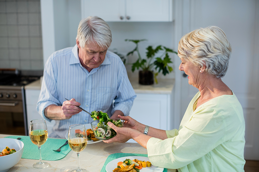 Senior couple having meal together 